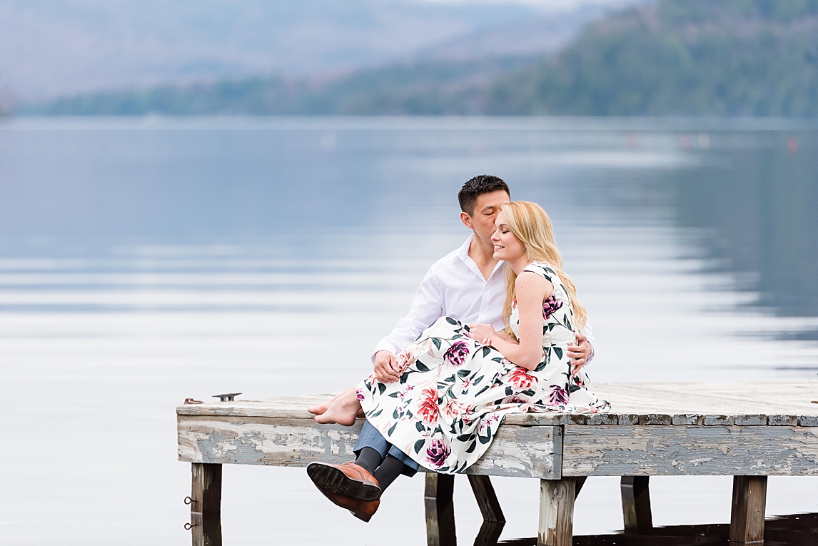 Lake_Placid_Adirondack_Engagement__WJ_Photos_0228 Groom kissing his bride on the cheek during engagement session in Lake Placid